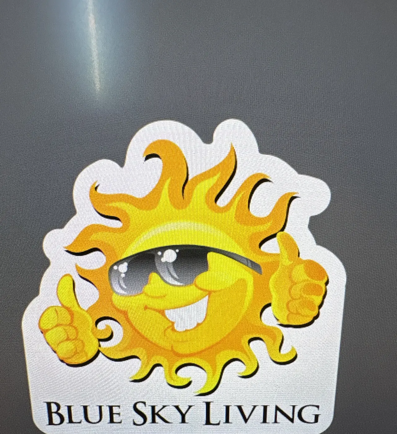 Die-cut Blue Sky Living sun sticker