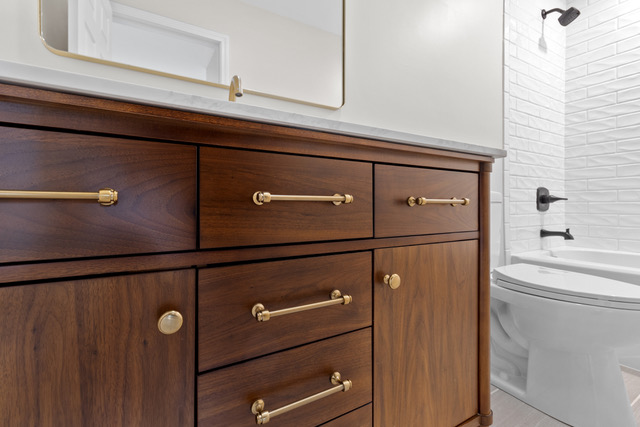 Bathroom vanity with brass hardware